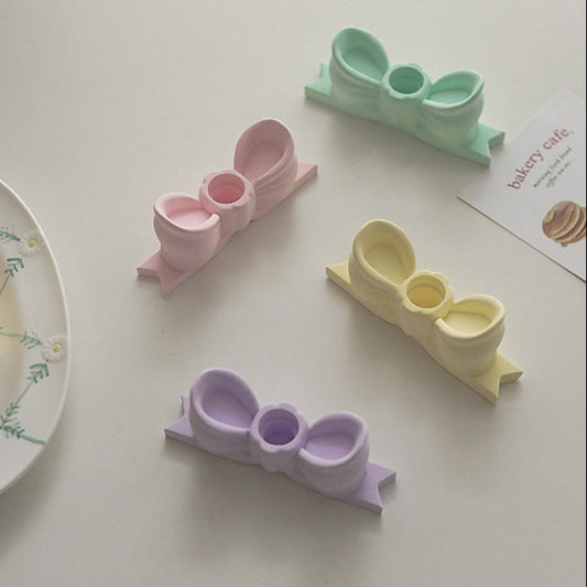 Bow candle holder